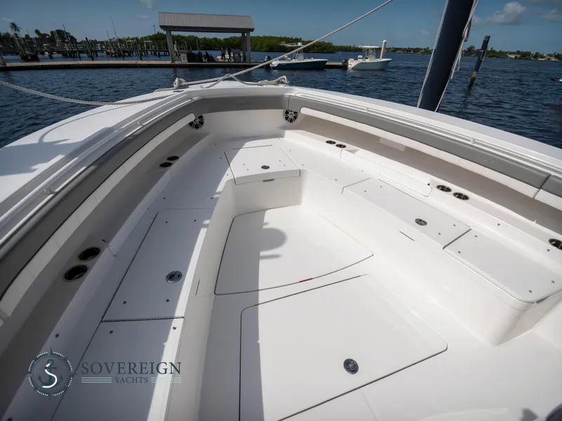 Slide: The Image of 2023 Regulator 41 boat deck with seating and storage compartments. - 18