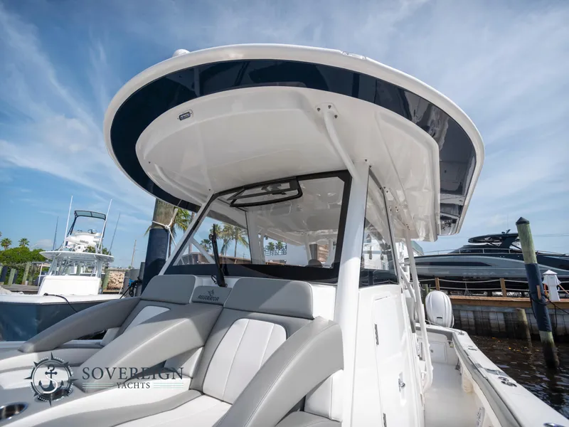 Slide: The Image of 2023 Regulator 41 boat at dock, Sovereign Yachts branding. - 19