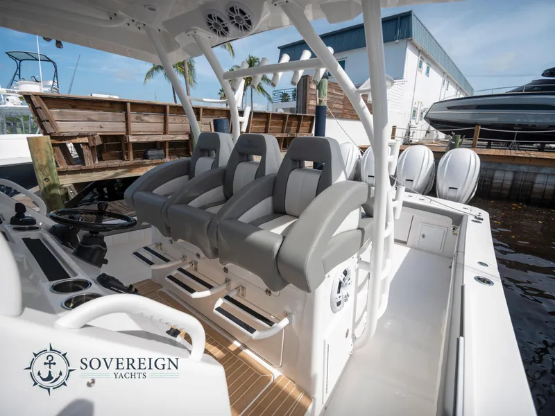 Slide: The Image of 2023 Regulator 41 boat interior with seating and controls at Sovereign Yachts. - 20