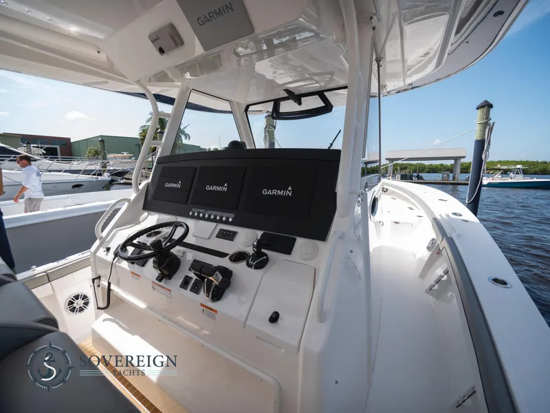 Slide: The Image of 2023 Regulator 41 boat helm with Garmin navigation system. - 22