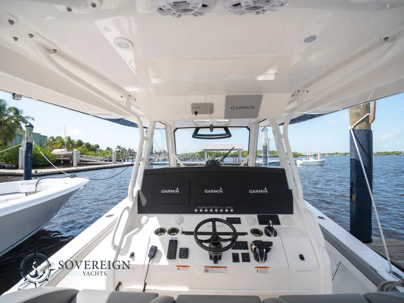 Slide: The Image of 2023 Regulator 41 yacht helm with Garmin electronics at Sovereign Yachts marina. - 25