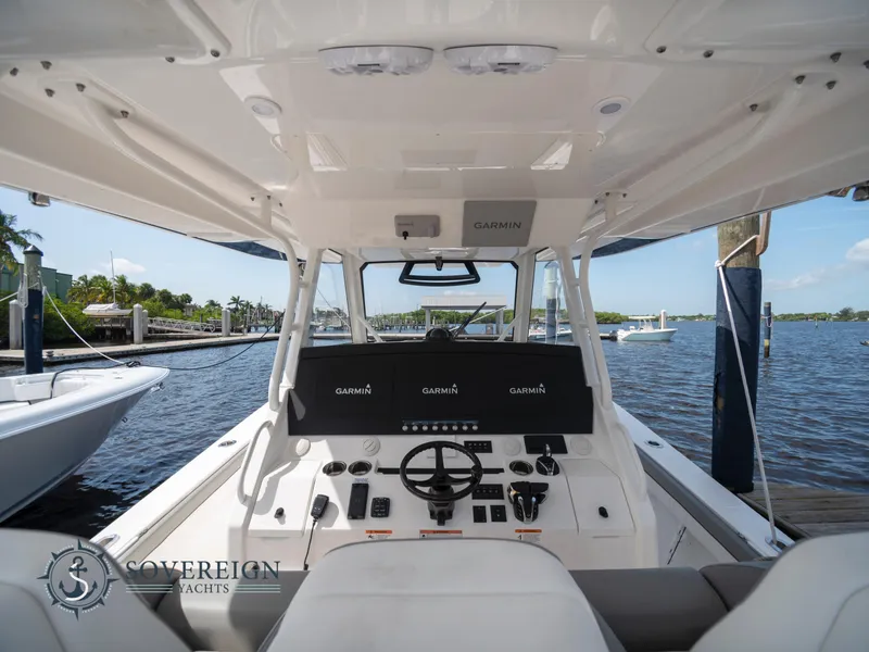 Slide: The Image of 2023 Regulator 41 yacht cockpit with advanced Garmin navigation system. - 26