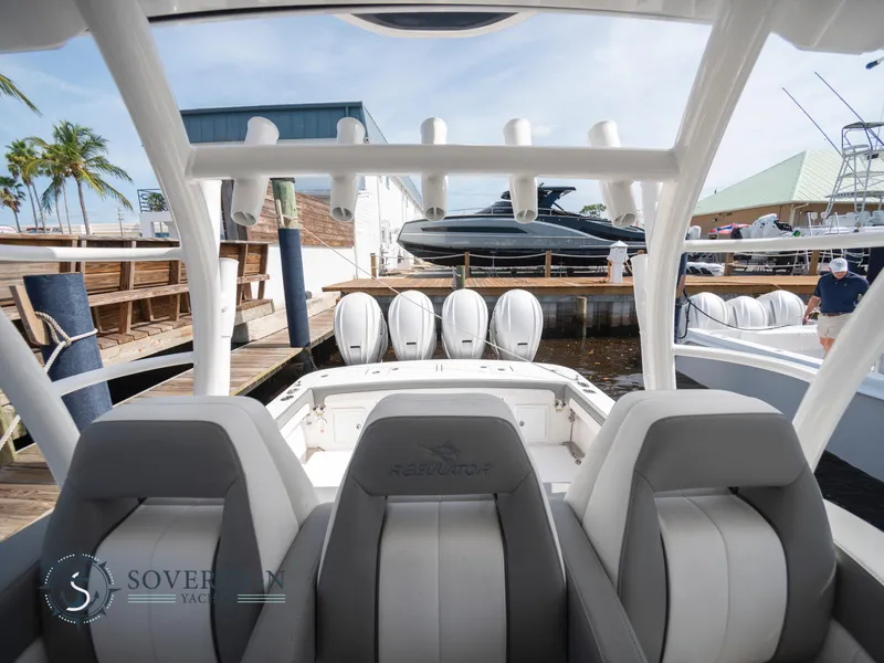 Slide: The Image of 2023 Regulator 41 boat with quad engines docked at a marina. - 27