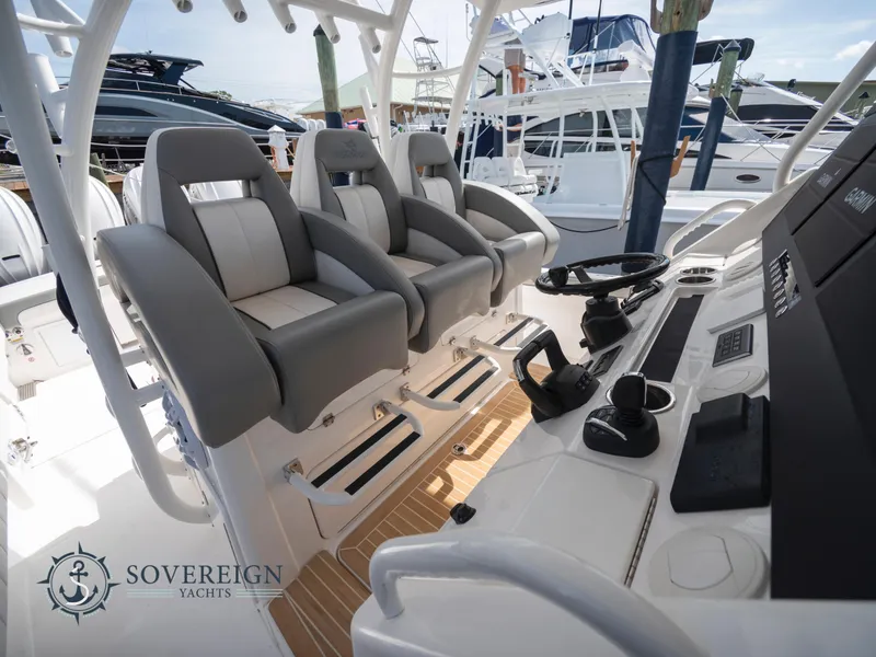 Slide: The Image of 2023 Regulator 41 yacht cockpit with helm seats and control panel at Sovereign Yachts. - 28