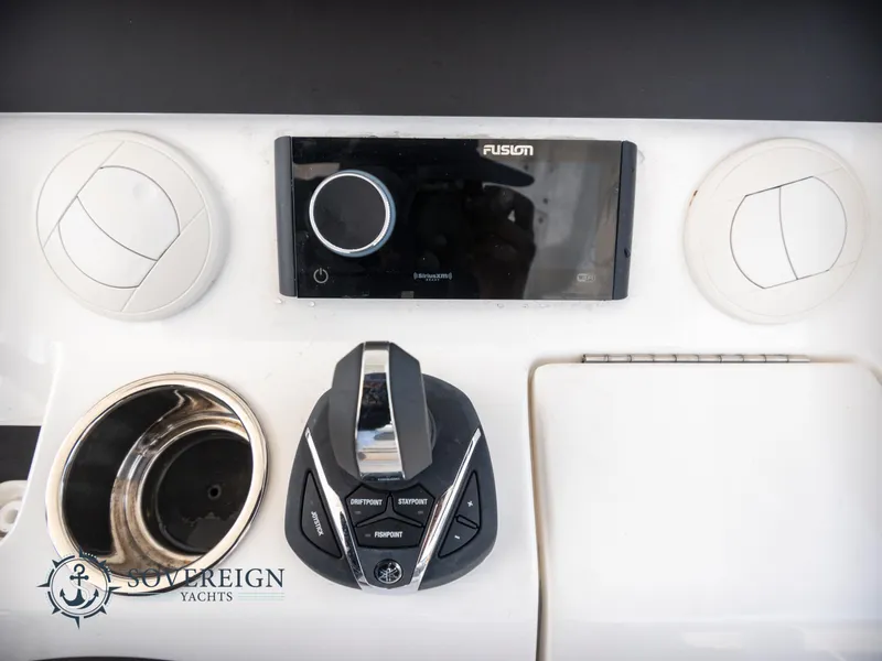 Slide: The Image of Control panel of a 2023 Regulator 41 yacht with Fusion audio system. - 34