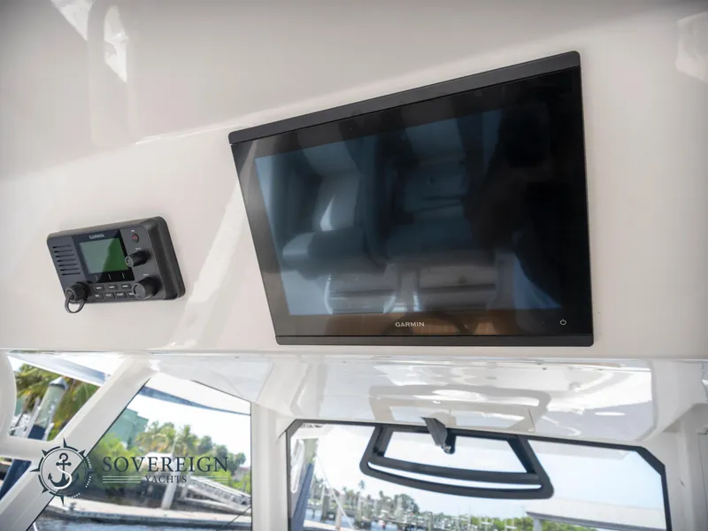 Slide: The Image of 2023 Regulator 41 boat interior with Garmin display and control panel. - 35