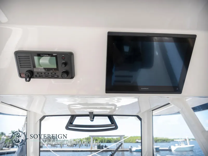 Slide: The Image of 2023 Regulator 41 yacht interior with Garmin electronics and Sovereign Yachts logo. - 36