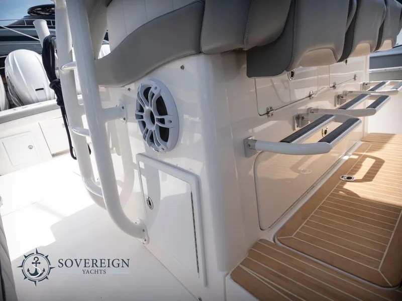 Slide: The Image of 2023 Regulator 41 yacht interior with seating and speaker system. Sovereign Yachts logo visible. - 38