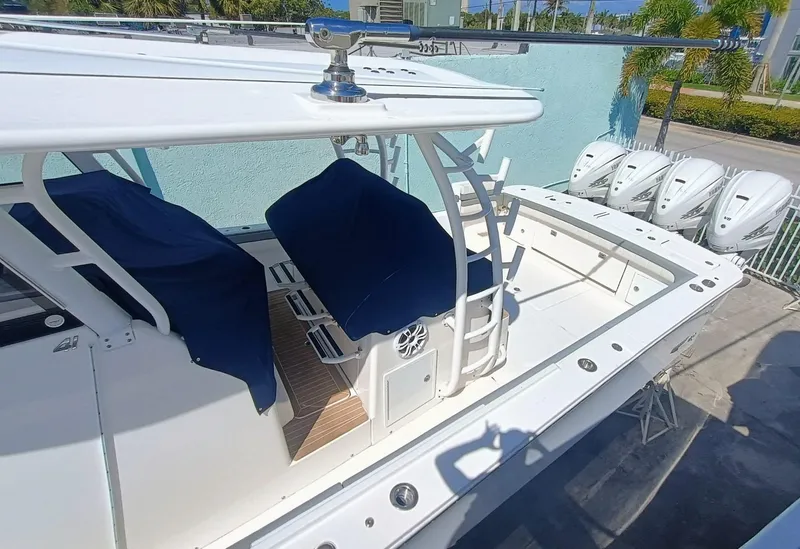Slide: The Image of 2023 Regulator 41 boat with blue seat covers and multiple outboard engines. - 4