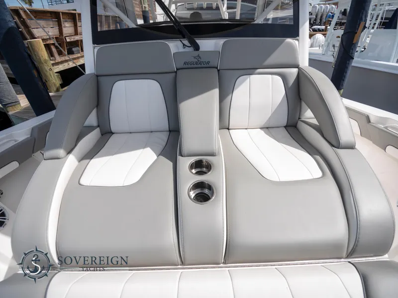 Slide: The Image of 2023 Regulator 41 boat with luxurious seating and cup holders. - 41