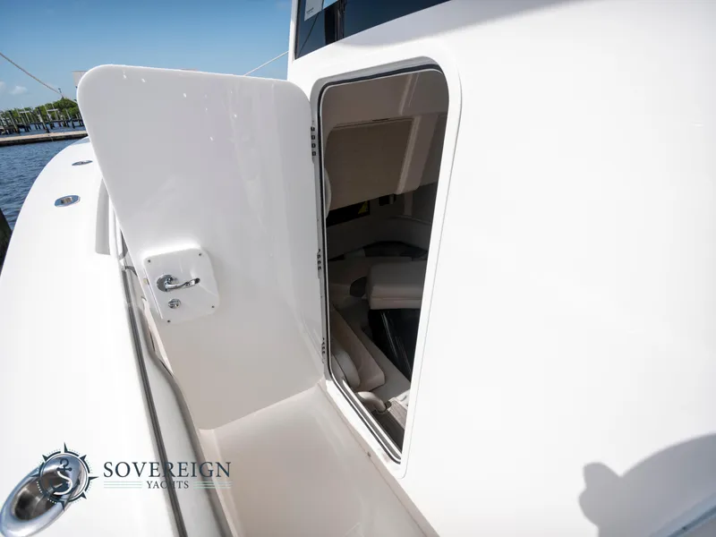 Slide: The Image of 2023 Regulator 41 yacht storage compartment open on deck. - 43