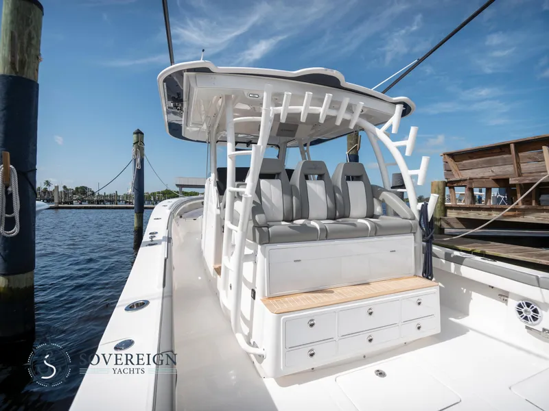 Slide: The Image of 2023 Regulator 41 yacht with seating and storage, docked at marina. - 6