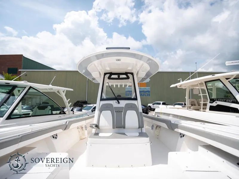 Slide: The Image of 2023 Regulator 34 boat at Sovereign Yachts dealership. - 10