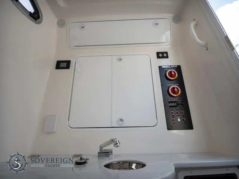 Slide: The Image of Control panel and sink area of a 2023 Regulator 34 boat by Sovereign Yachts. - 15