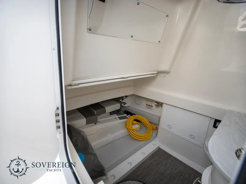 Slide: The Image of Interior storage compartment of 2023 Regulator 34 yacht with Sovereign Yachts logo. - 16