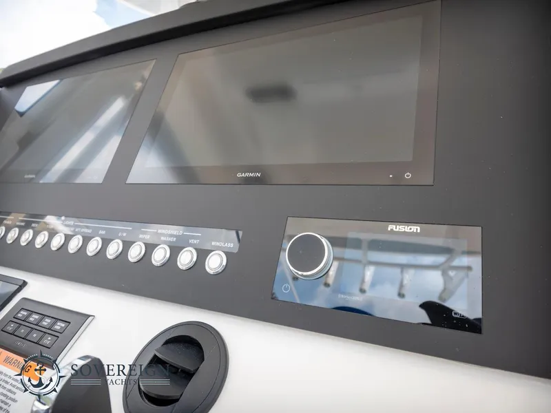 Slide: The Image of Control panel of 2023 Regulator 34 boat with Garmin and Fusion displays. - 20