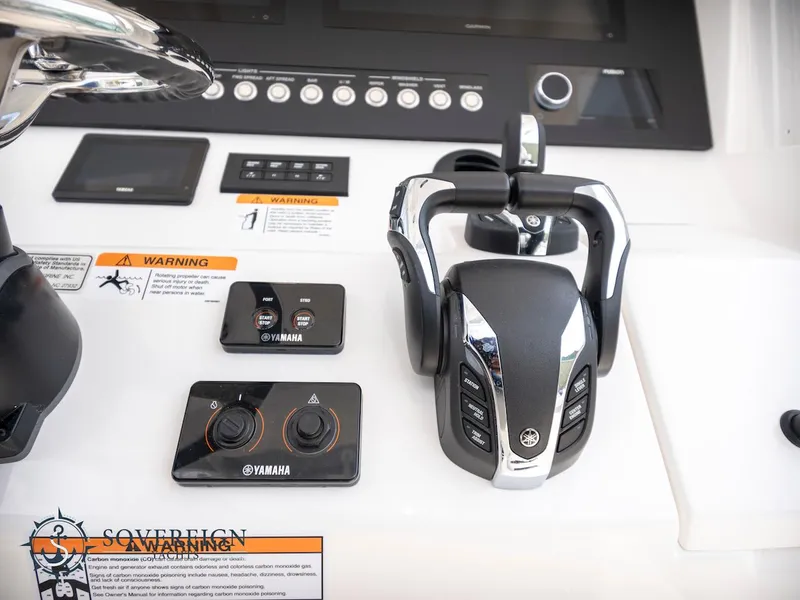 Slide: The Image of Control panel of 2023 Regulator 34 boat with Yamaha throttle and controls. - 22