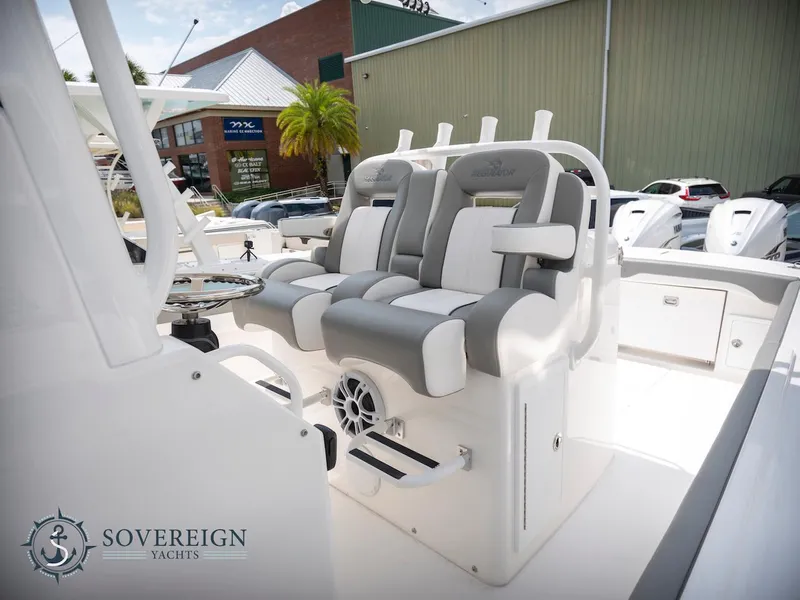 Slide: The Image of 2023 Regulator 34 boat interior with dual seating and Sovereign Yachts logo. - 23