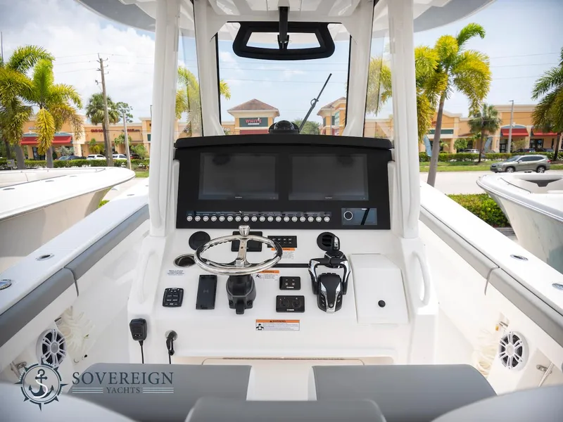 Slide: The Image of 2023 Regulator 34 boat dashboard with modern controls and dual screens. - 24