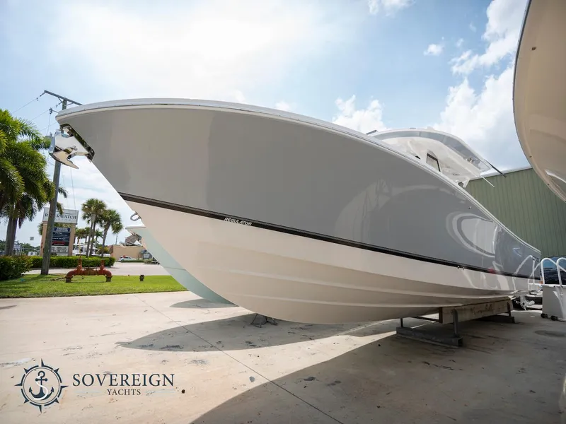 Slide: The Image of 2023 Regulator 34 boat displayed at Sovereign Yachts dealership. - 3