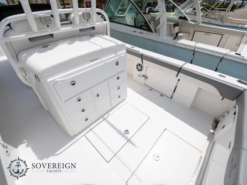 Slide: The Image of 2023 Regulator 34 boat deck with storage compartments, Sovereign Yachts branding. - 31