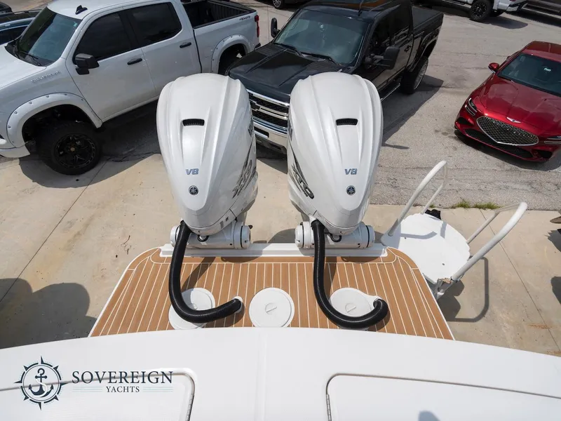Slide: The Image of 2023 Regulator 34 boat with twin V8 engines at Sovereign Yachts dealership. - 36