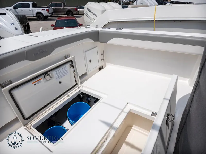 Slide: The Image of 2023 Regulator 34 boat deck with storage compartments and Sovereign Yachts logo. - 37
