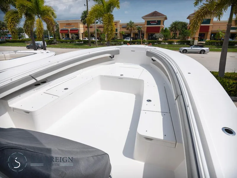 Slide: The Image of 2023 Regulator 34 boat with spacious seating and storage compartments. - 38