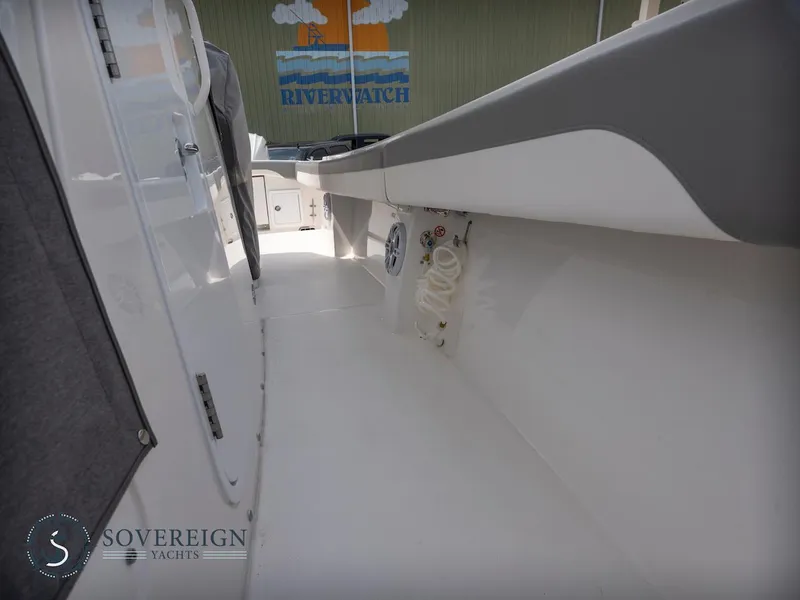 Slide: The Image of 2023 Regulator 34 boat deck with Sovereign Yachts branding. - 42