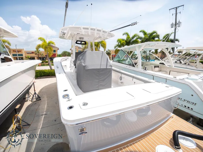 Slide: The Image of 2023 Regulator 34 boat docked at a marina, Sovereign Yachts logo visible. - 7
