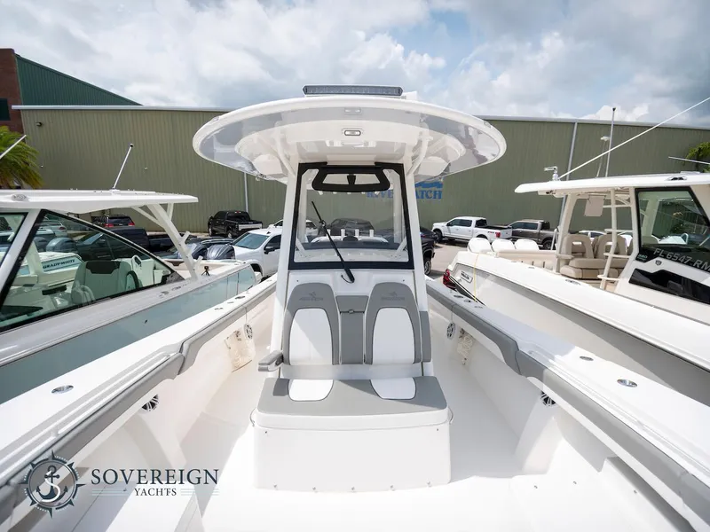 Slide: The Image of 2023 Regulator 34 yacht with center console and seating, displayed at Sovereign Yachts. - 9