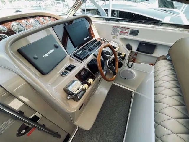 Slide: The Image of 2001 Sea Ray 340 AJ boat helm with modern navigation equipment. - 11