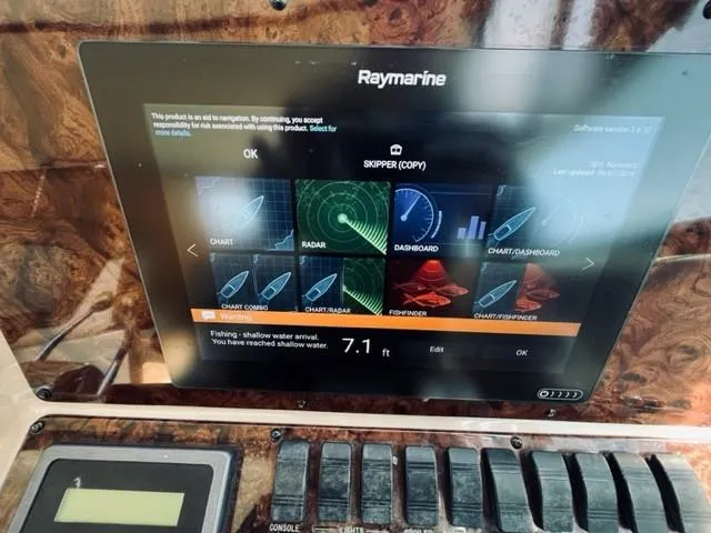 Slide: The Image of Raymarine navigation display on 2001 Sea Ray 340 AJ boat showing charts and radar. - 13