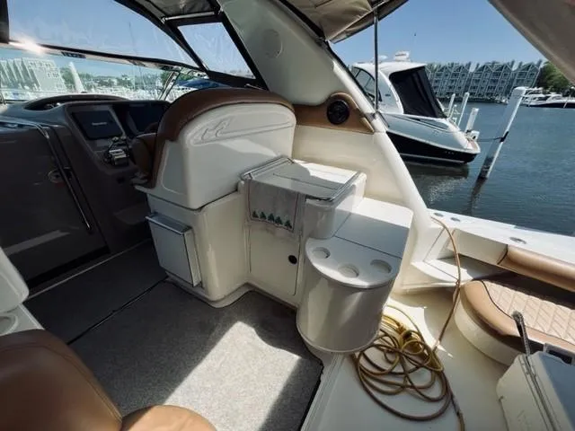 Slide: The Image of Interior of a 2001 Sea Ray 340 AJ boat docked at a marina. - 2