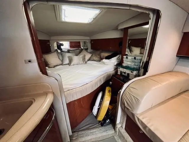 Slide: The Image of Interior cabin of 2001 Sea Ray 340 AJ with bed, seating, and storage. - 20