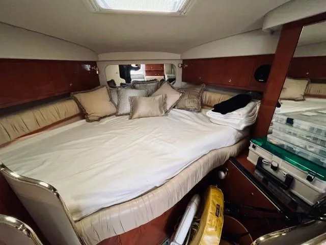 Slide: The Image of Interior cabin of 2001 Sea Ray 340 AJ with bed and storage compartments. - 21