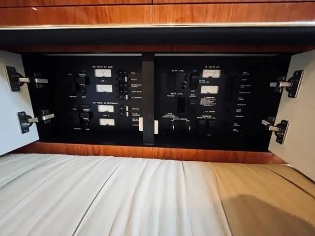 Slide: The Image of Electrical control panel inside a 2001 Sea Ray 340 AJ boat. - 24
