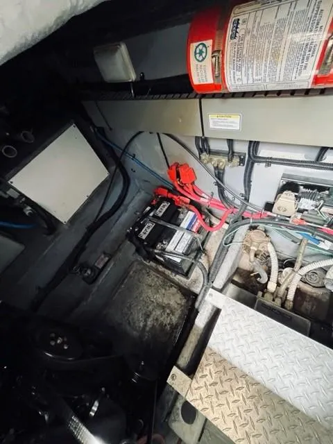 Slide: The Image of Engine compartment of a 2001 Sea Ray 340 AJ boat with batteries and wiring. - 28