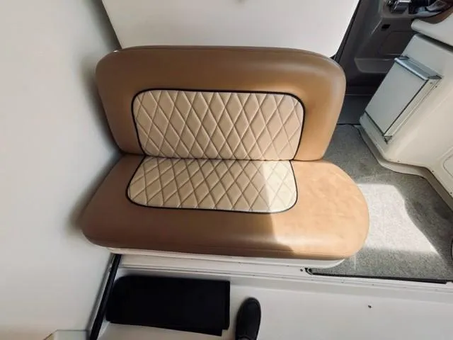 Slide: The Image of Tan and beige cushioned seat on a 2001 Sea Ray 340 AJ boat. - 3
