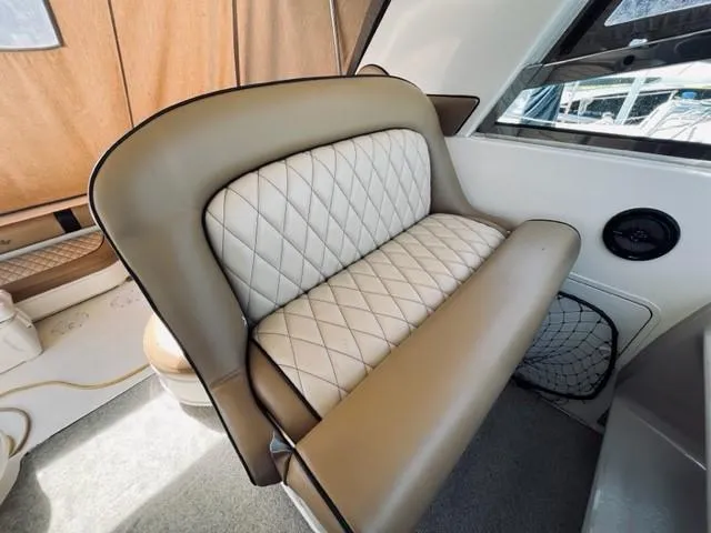Slide: The Image of Luxurious seating on a 2001 Sea Ray 340 AJ boat with diamond-stitched upholstery. - 4