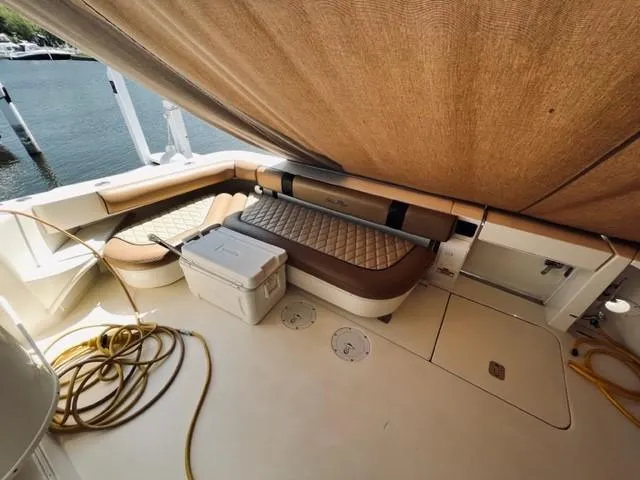 Slide: The Image of 2001 Sea Ray 340 AJ boat deck with seating, cooler, and canopy. - 5