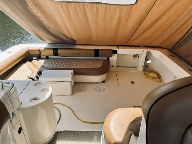 Slide: The Image of Interior of a 2001 Sea Ray 340 AJ boat with seating and storage. - 6