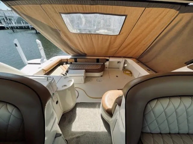 Slide: The Image of 2001 Sea Ray 340 AJ boat interior with seating and canopy. - 7
