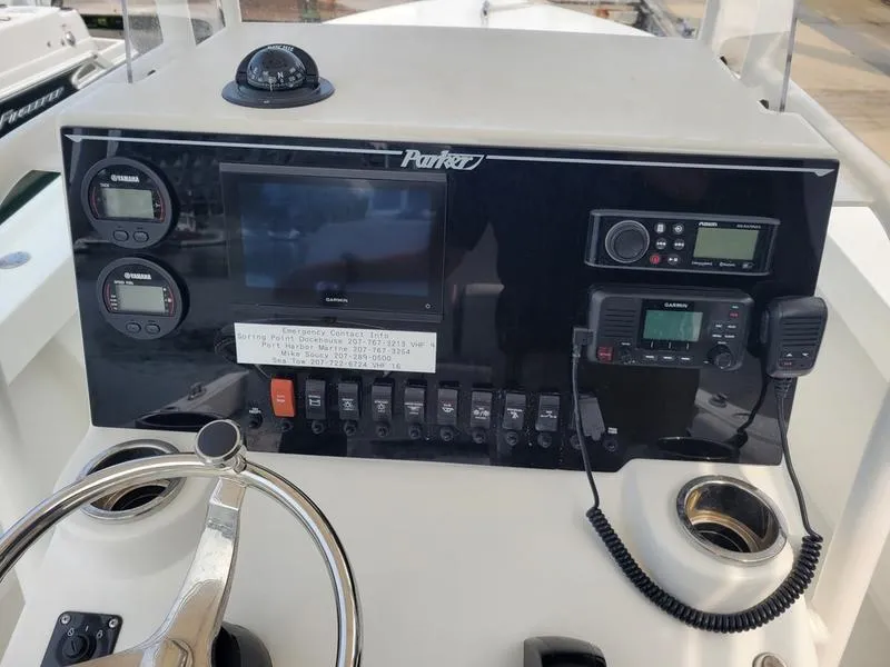 Slide: The Image of Parker 2100 SE 2023 boat dashboard with navigation and communication equipment. - 12