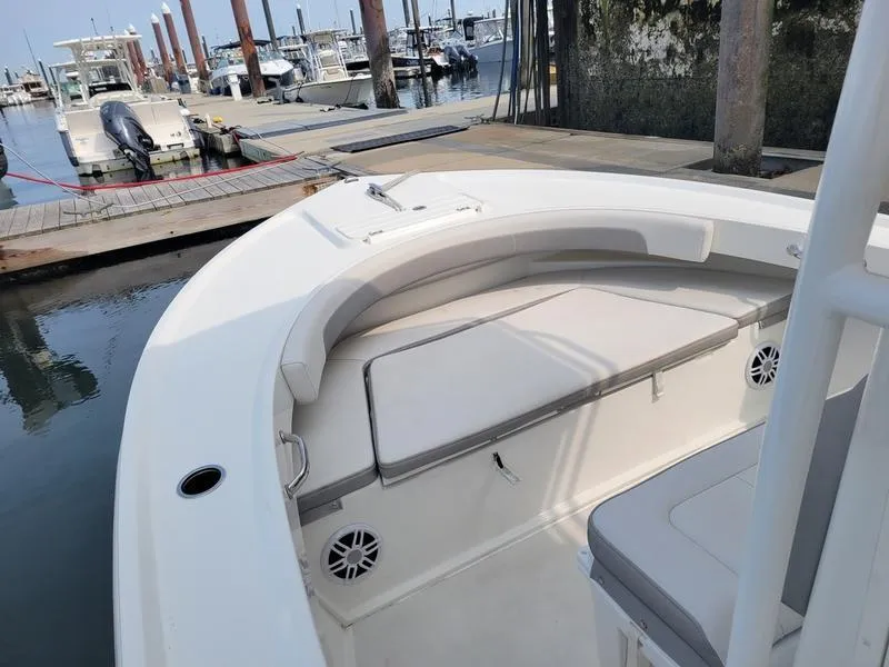 Slide: The Image of 2023 Parker 2100 SE boat interior at marina dock. - 2