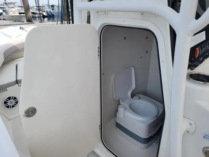 Slide: The Image of 2023 Parker 2100 SE boat with onboard portable toilet compartment. - 7