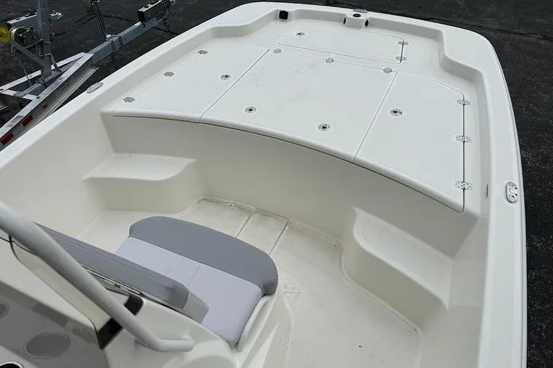 Slide: The Image of 2023 Mako SKIFF 19 CC boat interior with seating and storage compartments. - 11