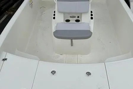 Slide: The Image of 2023 Mako SKIFF 19 CC boat interior with seating and storage compartments. - 13