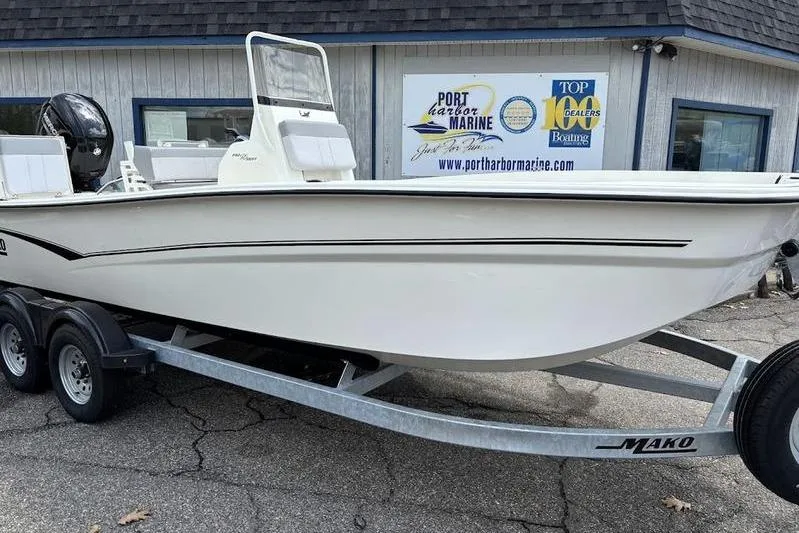 Slide: The Image of 2023 Mako SKIFF 19 CC boat on trailer at Port Harbor Marine dealership. - 24