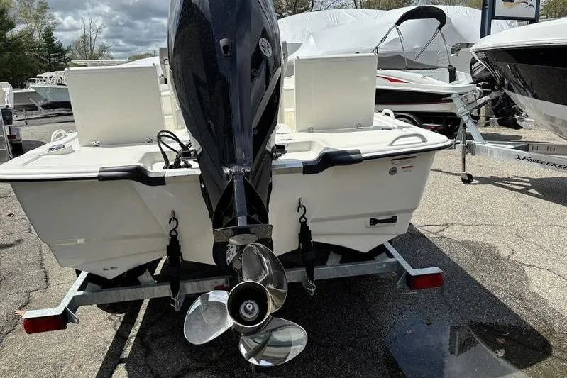 Slide: The Image of 2023 Mako SKIFF 19 CC boat on trailer, rear view with outboard motor. - 26
